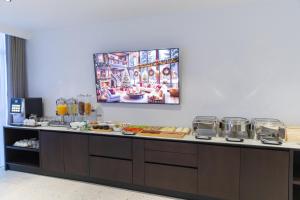 a buffet with food on a counter in a room at Hotel Allegra in Prishtinë