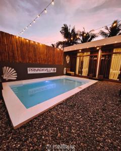 a swimming pool in the backyard of a house at Privada Villa Siargao in General Luna