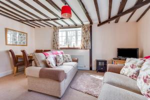 a living room with two couches and a tv at 2 Bed in Wangford oc-8hsw in Wangford