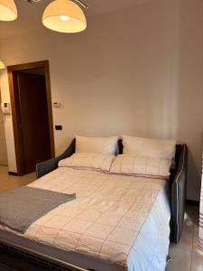 a bed with two pillows on it in a room at Casa San Martino 21 in Uboldo