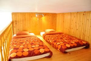 A bed or beds in a room at Traditional Slovak Apartment