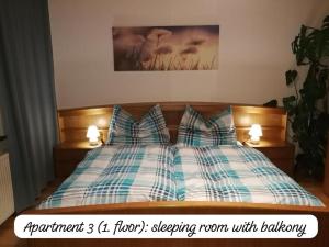a bedroom with a bed with pillows on it at Angi's Apartment in Sankt Lorenzen ob Murau
