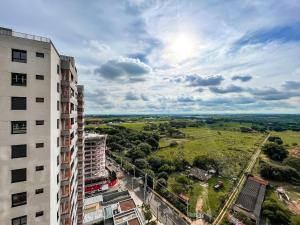 an overhead view of a building and a green field at Condomínio Residencial Hype 017 - São José do Rio Preto in Sao Jose do Rio Preto
