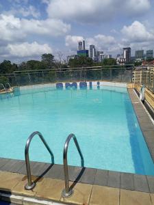 a large swimming pool on top of a building at Executive Express Rooftop Pool suites- Ngara in Nairobi +33 photos