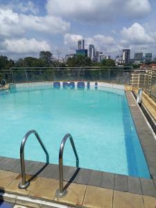 a large swimming pool on top of a building at Executive Express Rooftop Pool suites- Ngara in Nairobi