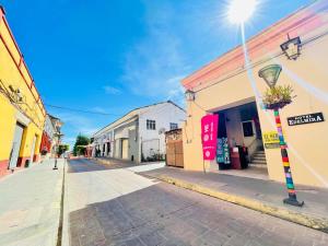 an empty street in a town with a street light at HOTEL EDELMIRA in Comitán