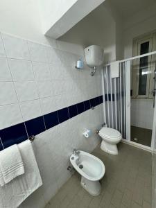 a bathroom with a toilet and a bidet at Hotel Valente in Ortona +65 photos
