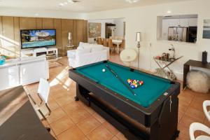 a living room with a pool table at Resort-Style Home with Pool House in Miami