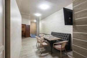 a dining room with a table and chairs at Boutique Hotel Tomiris in Astana