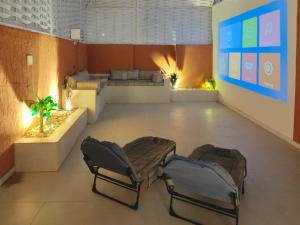 a lobby with two chairs and a couch in a room at NOVA Homes in Medina