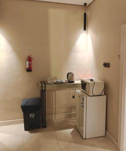 a kitchen with a microwave on top of a refrigerator at NOVA Homes in Medina +34 photos