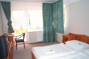 Postel nebo postele na pokoji v ubytování Well Hotel