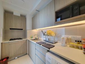 a kitchen with a sink and a counter top at Sea view Apartmen in Trizen in Colombo
