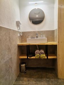 a bathroom with a sink and a mirror at Schirfhof in Michaelerberg +51 photos