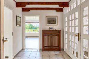 a hallway with a door leading into a room at Lund36 in Husum