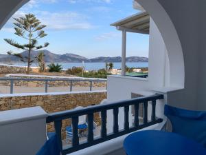 a balcony with a view of the beach at Melissa Rooms in Koufonisia