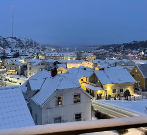 a view of a city with snow covered roofs at Grebbestad city in Grebbestad