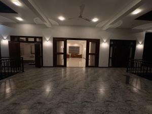 an empty room with a ceiling fan and an open door at Danketiya Palace in Ahangama