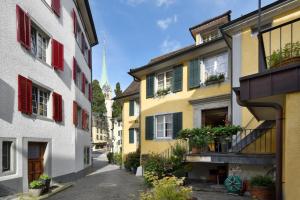 an alley in the old town of lille with colorful houses at Romantik Hotel Schwan in Horgen