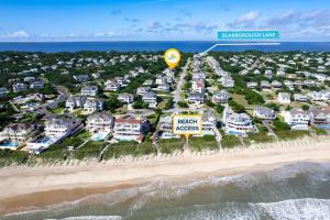an aerial view of a beach with houses at 2070 - Sol Mates in Duck +59 photos