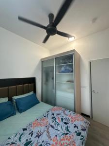 a bedroom with a bed and a ceiling fan at Putrajaya Antara Residence, Near PICC, Presint 5 in Putrajaya +16 photos
