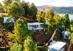 an aerial view of a house with trees at Entre Islas LODGE in Aquitania