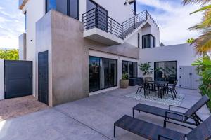 an image of a house with a patio at Modern House, Rooftop Ocean Views & Private Pool in El Centenario