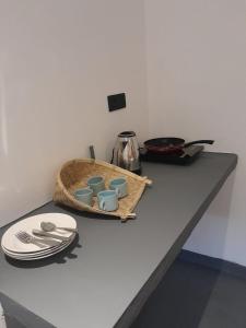 a table with a tray of dishes and a tea pot at Hiri Dudes Villa in Dickwella +18 photos