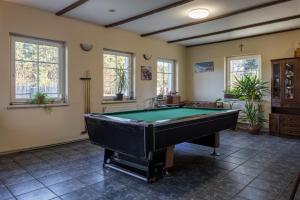 a large room with a pool table in it at Zajazd Milówka in Węgliniec