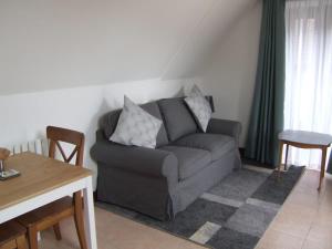 a living room with a couch and a table at Millbrook House Apartments 10 in Milton
