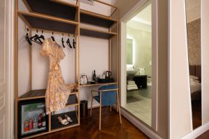 a dressing room with a mirror and a dressing table at Vittoriano Suite in Rome +102 photos