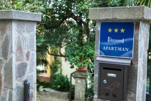 a parking meter with a sign that says argemark at Apartman Lori in Lovran