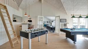 a large room with a pool table and a billiards table at Villavilla 441 - Grenå Strand, Østjylland in Grenå +30 photos
