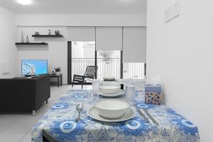 a table with plates and bowls on top of it at Old town studio in Limassol