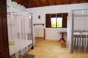 Postel nebo postele na pokoji v ubytování Ganesh Garden Beach Cabanas