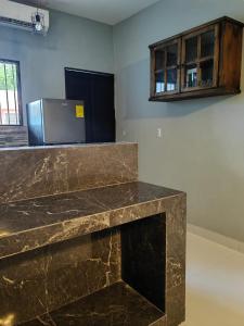 a kitchen with a counter top and a refrigerator at Casa Victoria in Valladolid