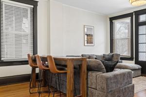 a living room with a table and a couch at Cozy Home near Downtown - Close to Nulu - Sleeps 6 in Louisville +68 photos