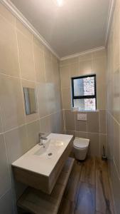a bathroom with a sink and a toilet at Solomon Guest House in Maseru +7 photos