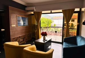 a living room with a view of a balcony at Marcsons Hotels and Resorts in Limbe