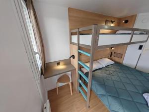 a small room with a bunk bed and a desk at Premiere Classe Nancy Est Essey in Essey-lès-Nancy +76 photos