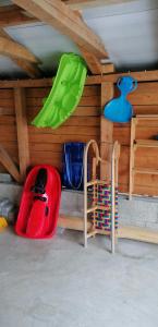 a toy room with a toy car and chairs at Qvintesencia Terchová in Terchová
