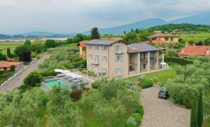 an aerial view of a house with a swimming pool at Biancaleo Homes in Affi