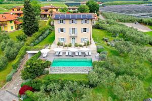an aerial view of a house with a swimming pool at Biancaleo Homes in Affi