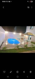 a picture of a swimming pool at night at Casa temporada aracaju sergipe in Aracaju +2 photos