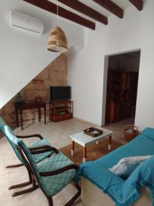 a living room with a couch and a table at ca sa tia in Santanyi +27 photos