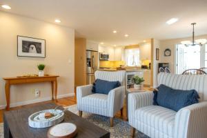 a living room with two chairs and a table at Spacious Home by Beach Dog Welcome in Brewster