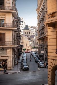 a city street with cars parked on the street at Cairo Capital Hotel by SK in Cairo
