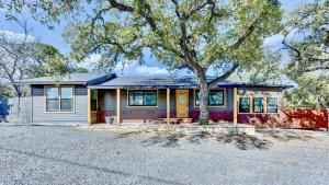 a small house with a tree in front of it at Downtown Studio 1 at Beer Ranch Project Inn in Wimberley