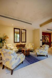 a living room with couches and a table at Casa Stella - Authentic Luxury Rooftop Pool in Cartagena de Indias +235 photos