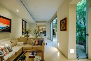 a living room with a couch and a table at Casa Stella - Authentic Luxury Rooftop Pool in Cartagena de Indias